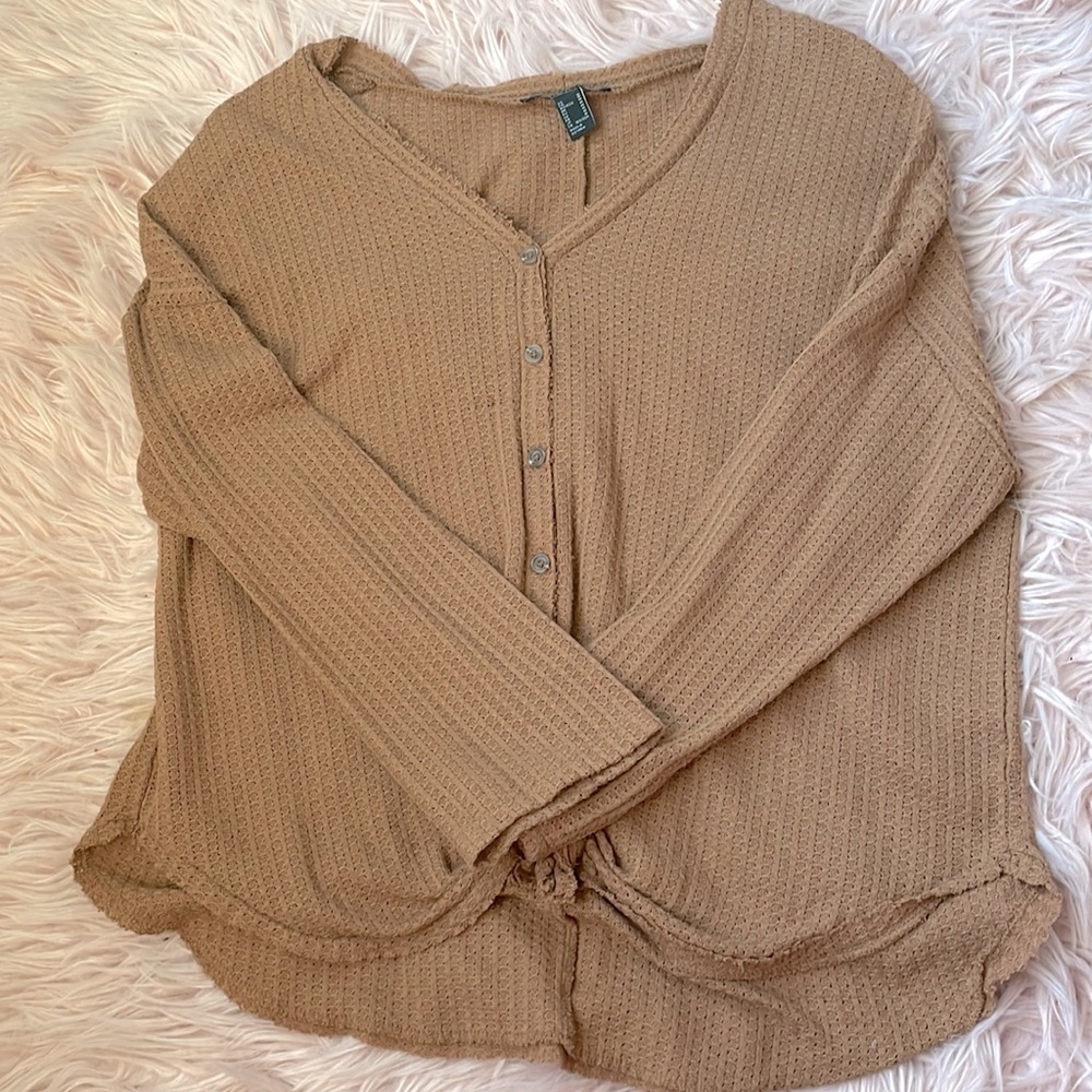 Oversized blouse with a tie at front